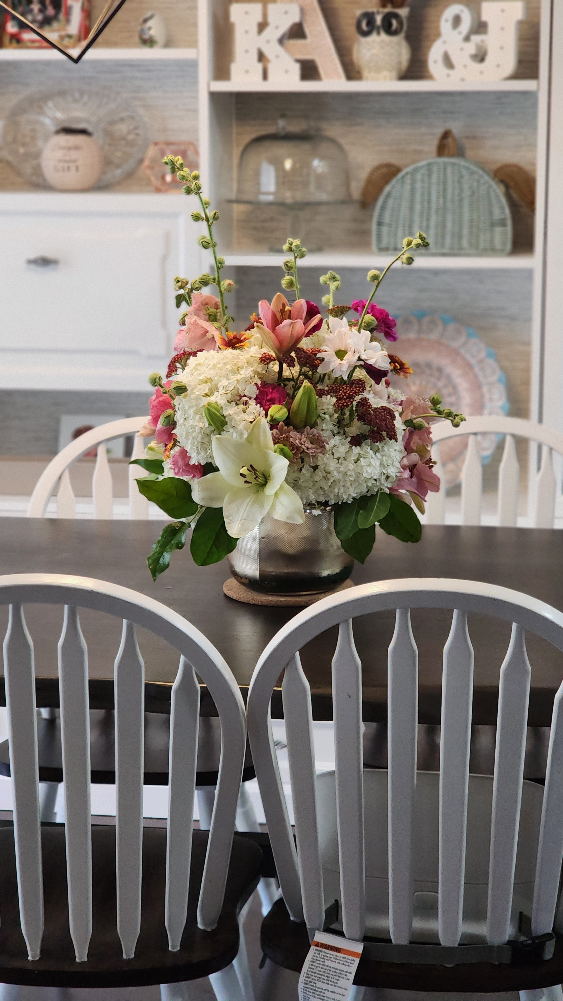 Fresh flower arrangement in vase with natural light