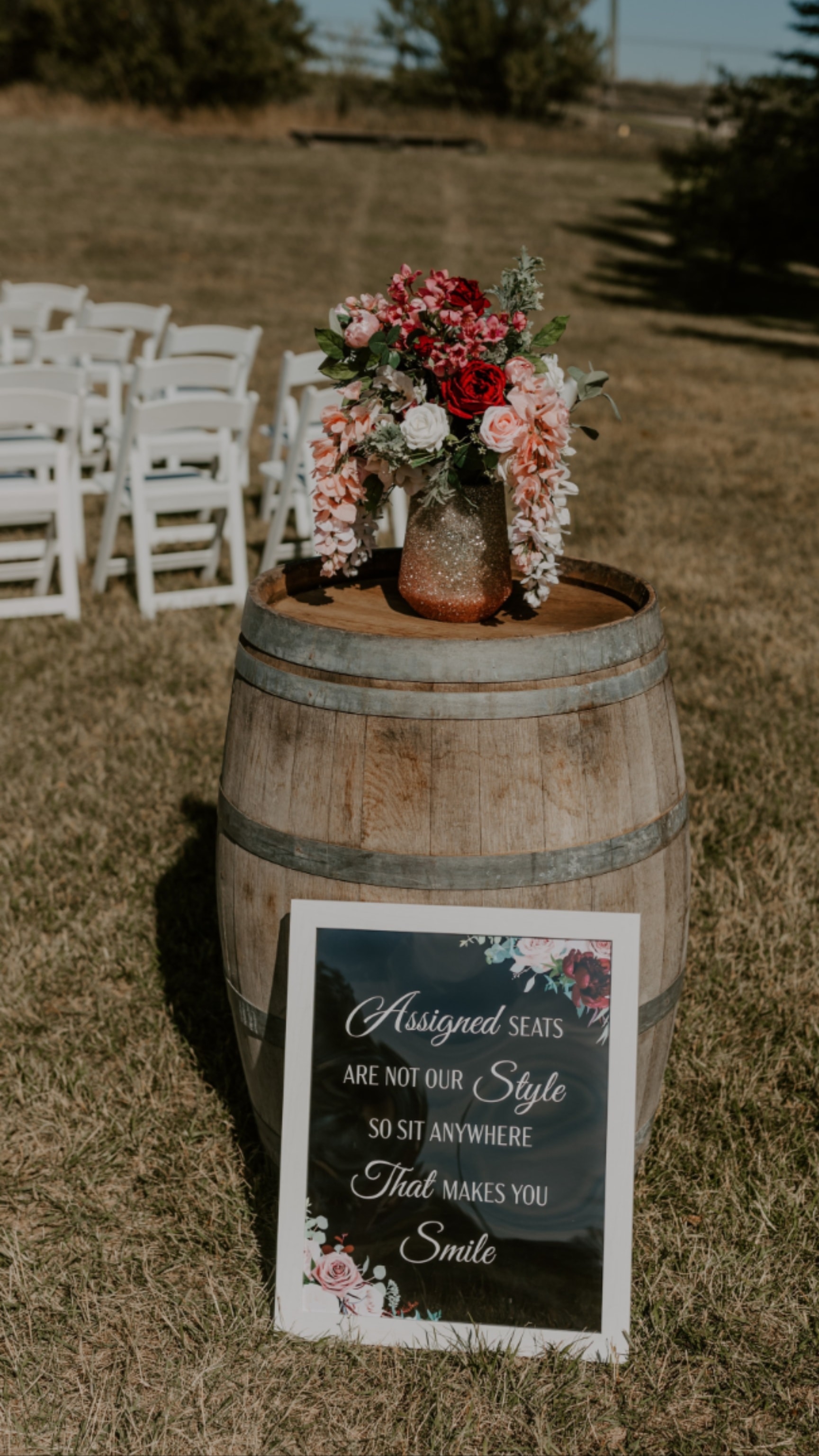 Elegant wedding table floral centerpiece with roses and candlelight